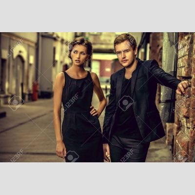 42791029-fashion-style-photo-of-a-beautiful-couple-over-city-background-